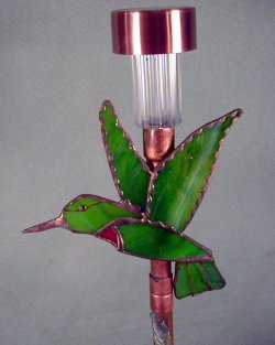 small solar
                light with hummingbird
